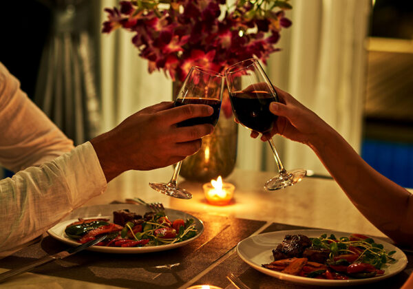 happy couple on summer evening having romantic dinner.